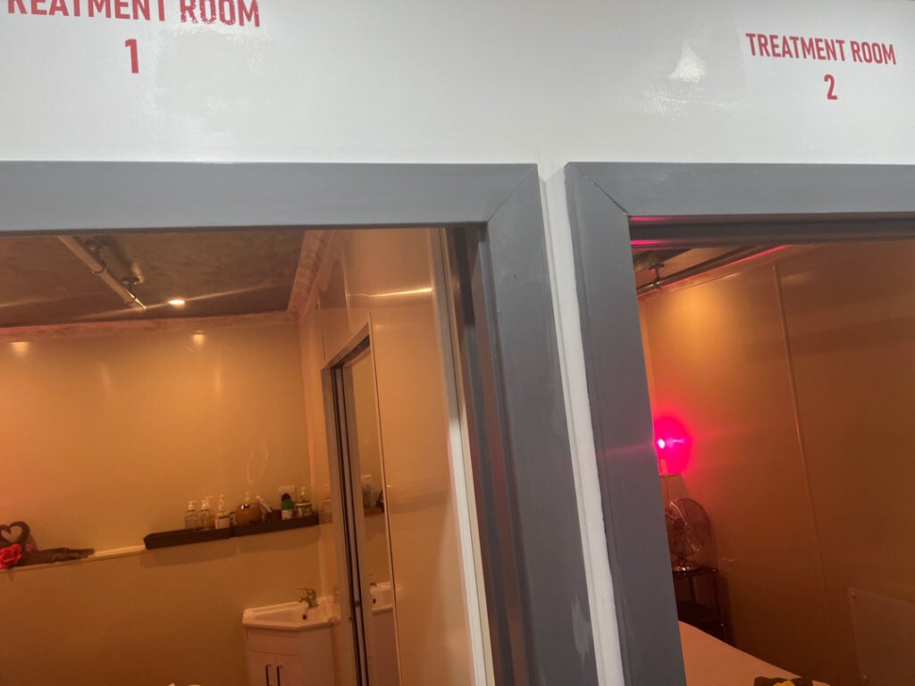 Two welcoming massage treatment rooms with calming lighting and a serene atmosphere, perfect for relaxation and rejuvenation in a Woolmer Green spa.