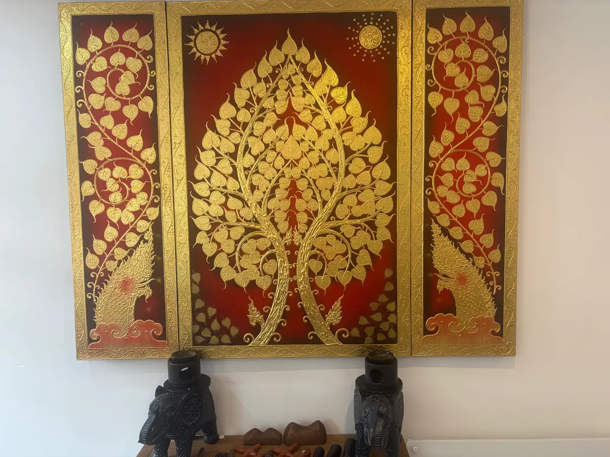Gold-leaf Thai artwork in reception