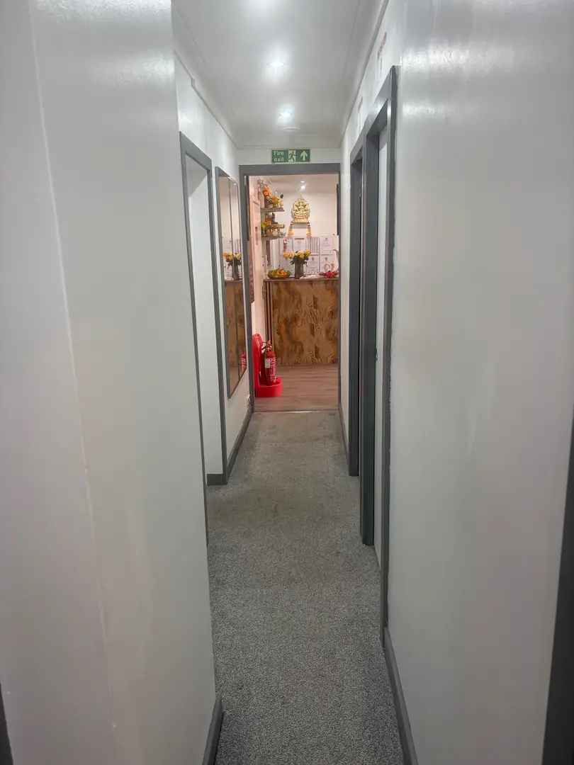 Quiet hallway leading to the treatment rooms